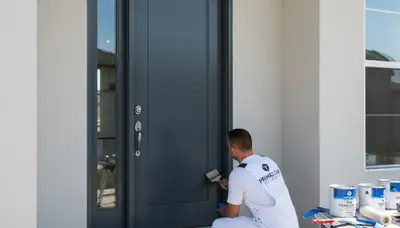 Professional door painting service in Bloomington IN showcasing freshly refinished front entry door