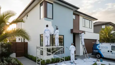Professional exterior house painters in Bloomington, IN applying durable weather-resistant paint